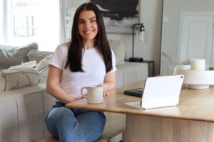 Rebecca Gilligan smiling at her desk